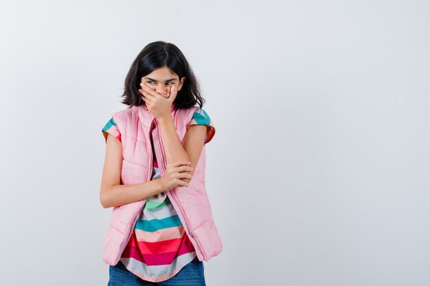 Expressive young girl posing in the studio