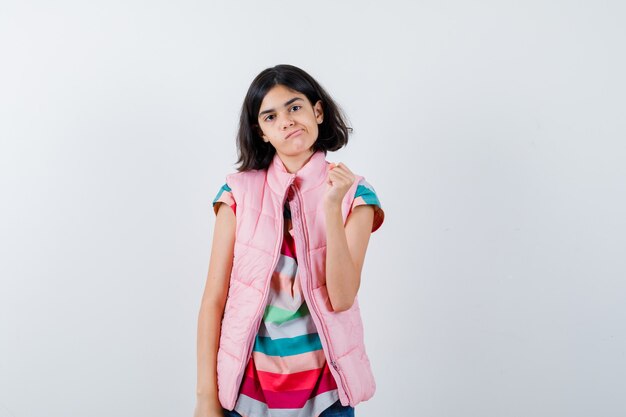 Expressive young girl posing in the studio