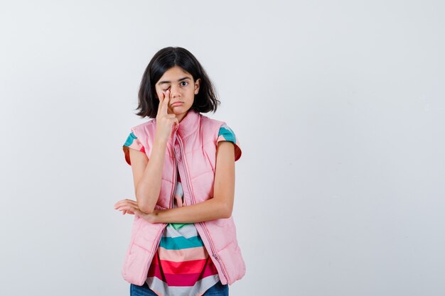 Expressive young girl posing in the studio