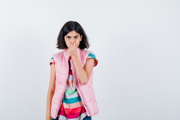 Expressive young girl posing in the studio