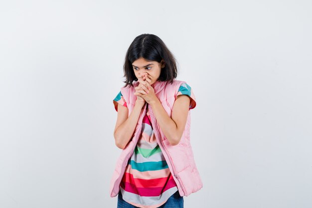 Expressive young girl posing in the studio