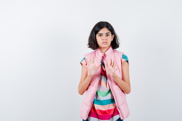 Expressive young girl posing in the studio