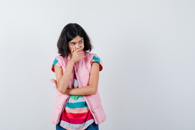 Expressive young girl posing in the studio