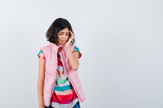 Expressive young girl posing in the studio