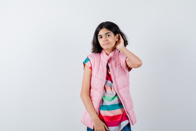 Expressive young girl posing in the studio