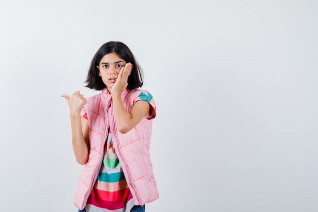 Expressive young girl posing in the studio