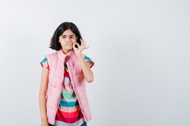 Expressive young girl posing in the studio