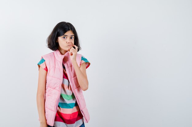 Expressive young girl posing in the studio