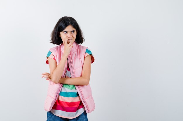 Expressive young girl posing in the studio