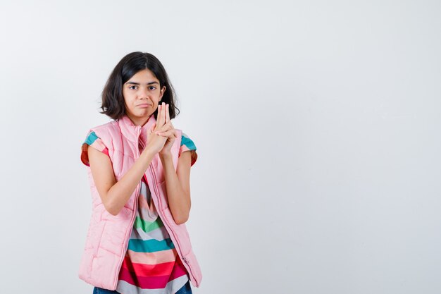 Expressive young girl posing in the studio