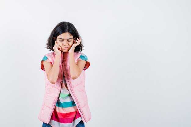 Expressive young girl posing in the studio