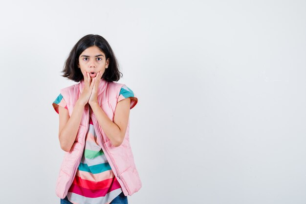 Expressive young girl posing in the studio