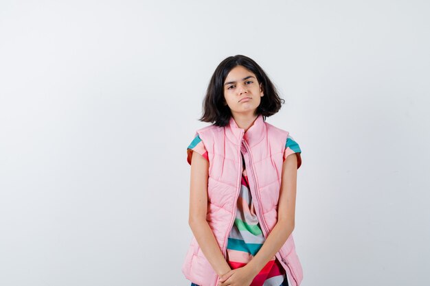 Expressive young girl posing in the studio