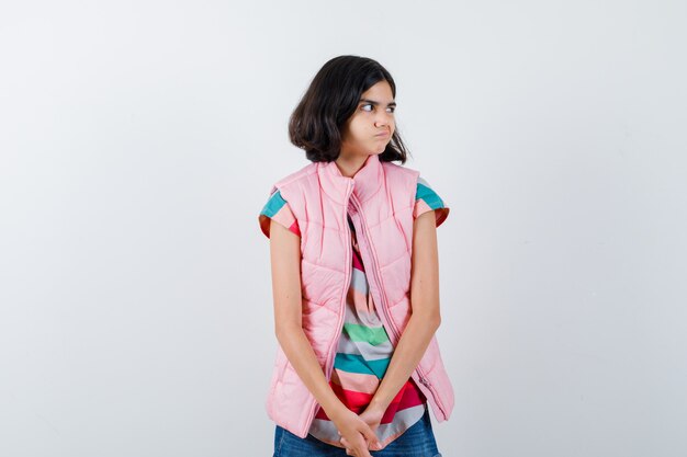 Expressive young girl posing in the studio