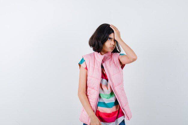 Expressive young girl posing in the studio