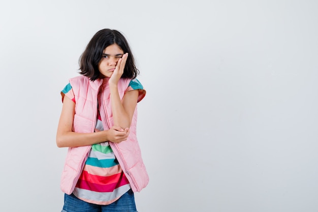 Expressive young girl posing in the studio