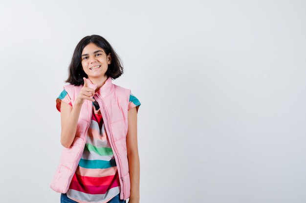 Expressive young girl posing in the studio