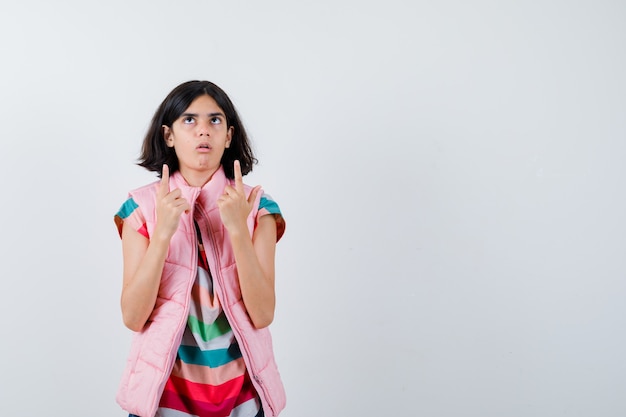 Expressive young girl posing in the studio