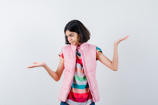 Expressive young girl posing in the studio