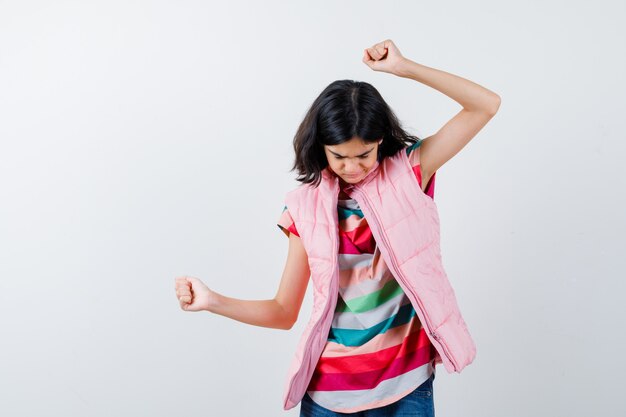 Expressive young girl posing in the studio