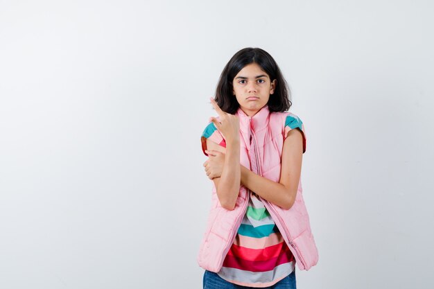 Expressive young girl posing in the studio