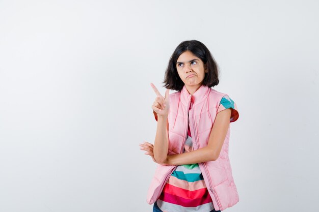 Expressive young girl posing in the studio