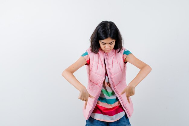 Expressive young girl posing in the studio