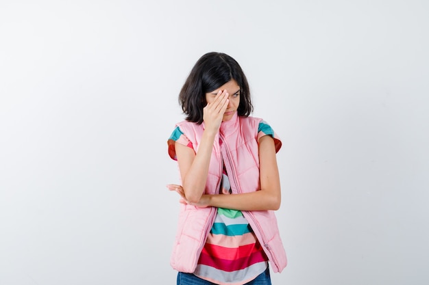 Expressive young girl posing in the studio