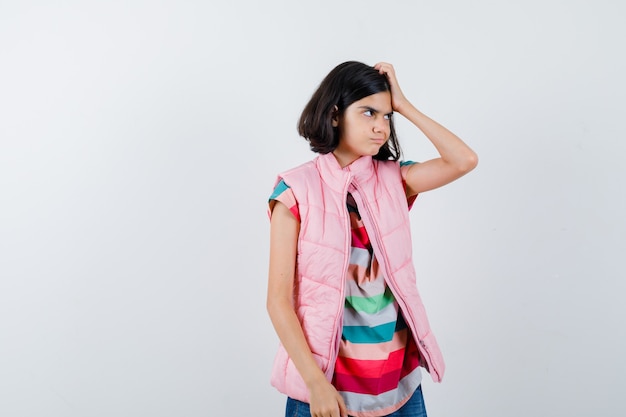 Expressive young girl posing in the studio