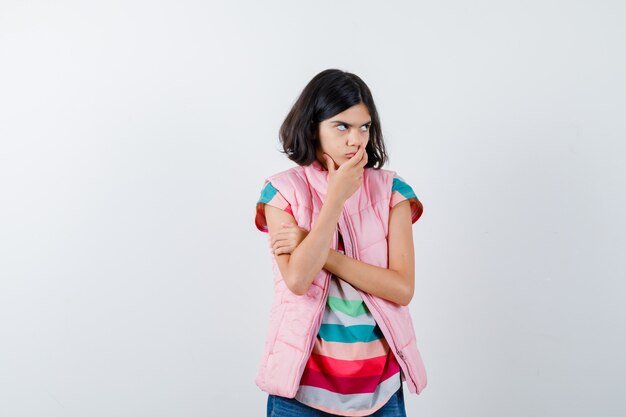 Expressive young girl posing in the studio