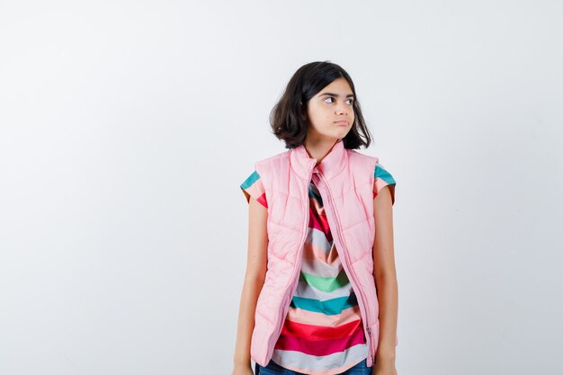 Expressive young girl posing in the studio