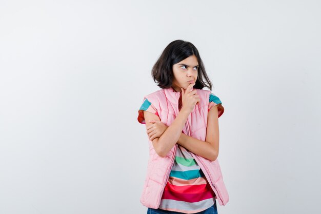 Expressive young girl posing in the studio