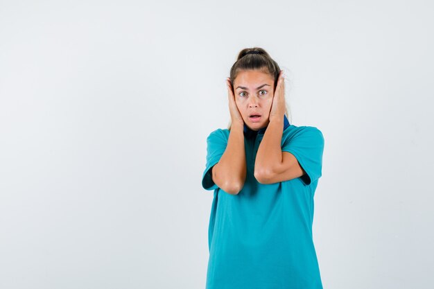 Expressive young girl posing in the studio