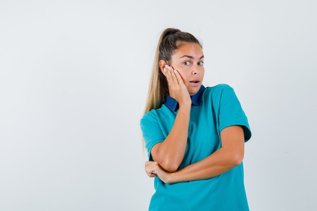 Expressive young girl posing in the studio