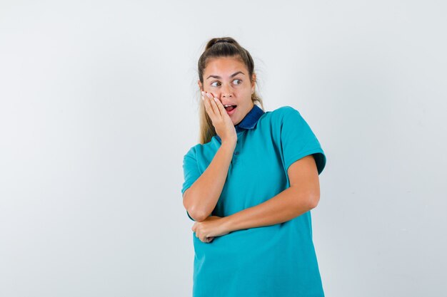 Expressive young girl posing in the studio