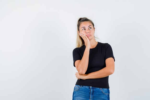 Expressive young girl posing in the studio