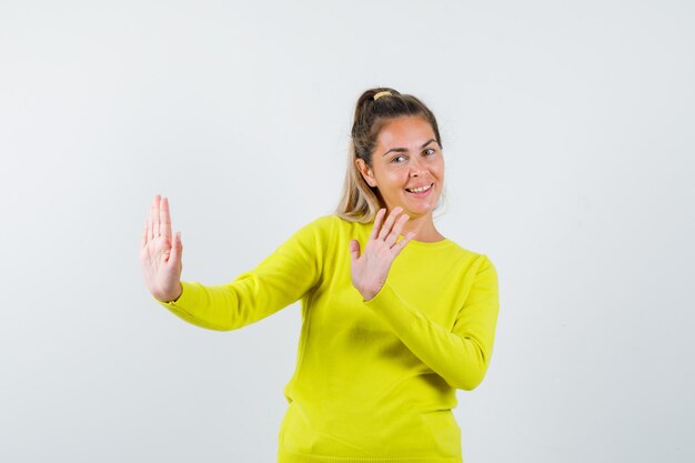 Expressive young girl posing in the studio