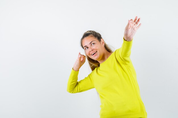 Expressive young girl posing in the studio