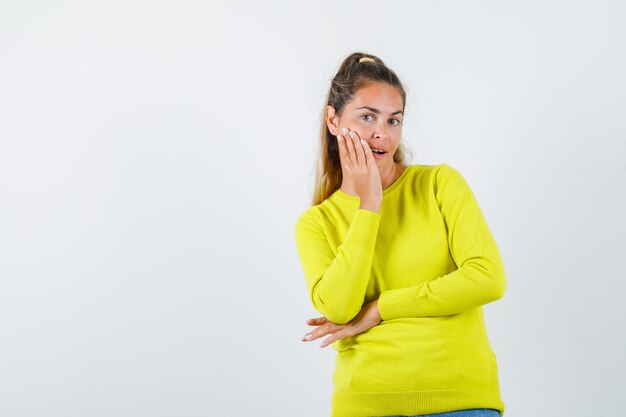 Expressive young girl posing in the studio