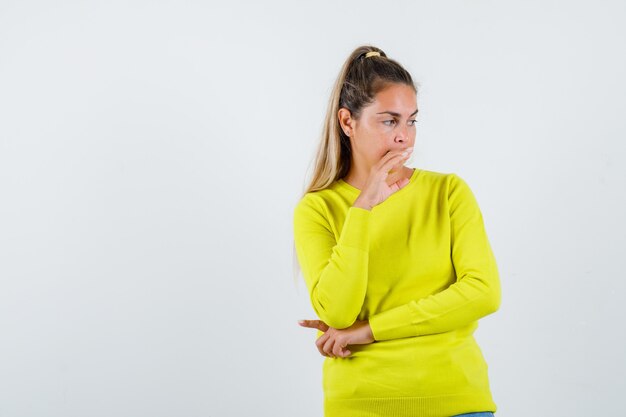 Expressive young girl posing in the studio