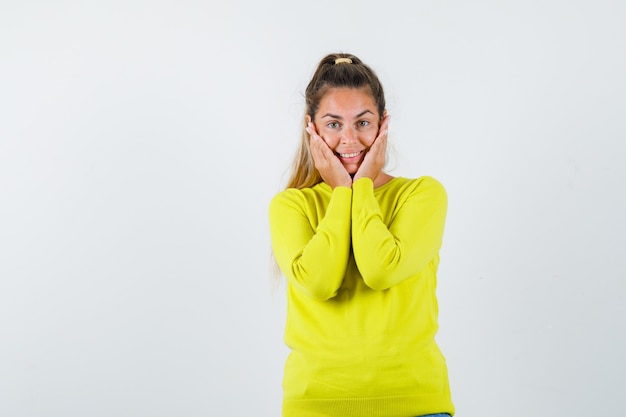 Expressive young girl posing in the studio