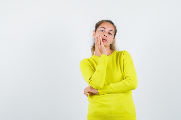 Expressive young girl posing in the studio