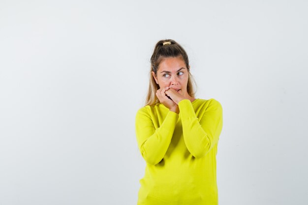 Expressive young girl posing in the studio