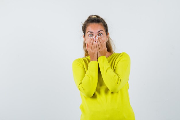 Expressive young girl posing in the studio