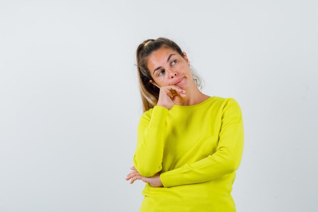 Expressive young girl posing in the studio