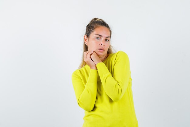 Expressive young girl posing in the studio