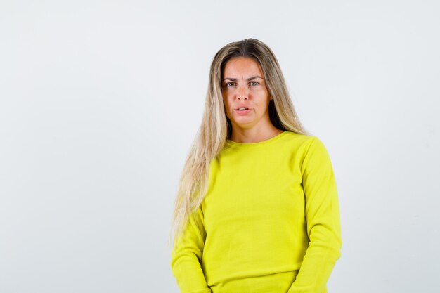 Expressive young girl posing in the studio