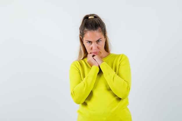 Expressive young girl posing in the studio