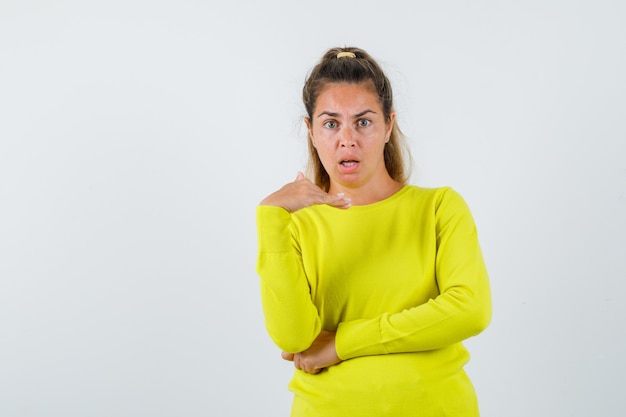 Expressive young girl posing in the studio