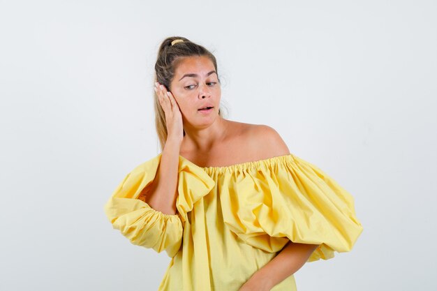 Expressive young girl posing in the studio